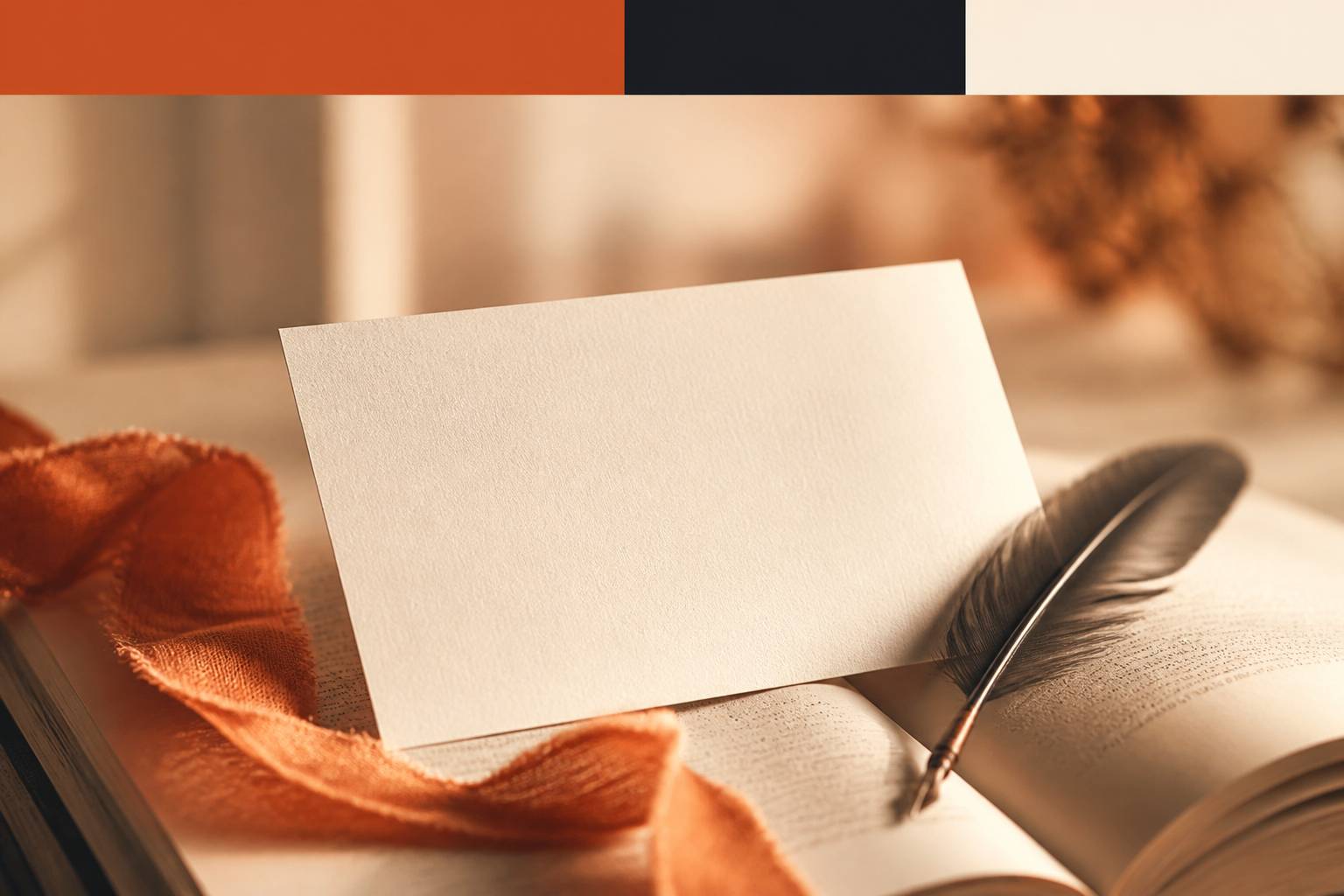 Carte blanche posée sur un livre ouvert avec plume et ruban